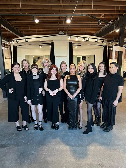 true crew posing in bridal salon wearing black