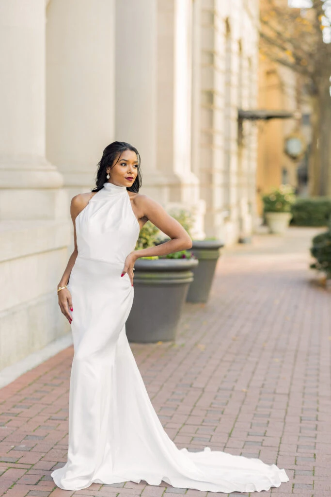 Bride wearing a high neck satin wedding dress