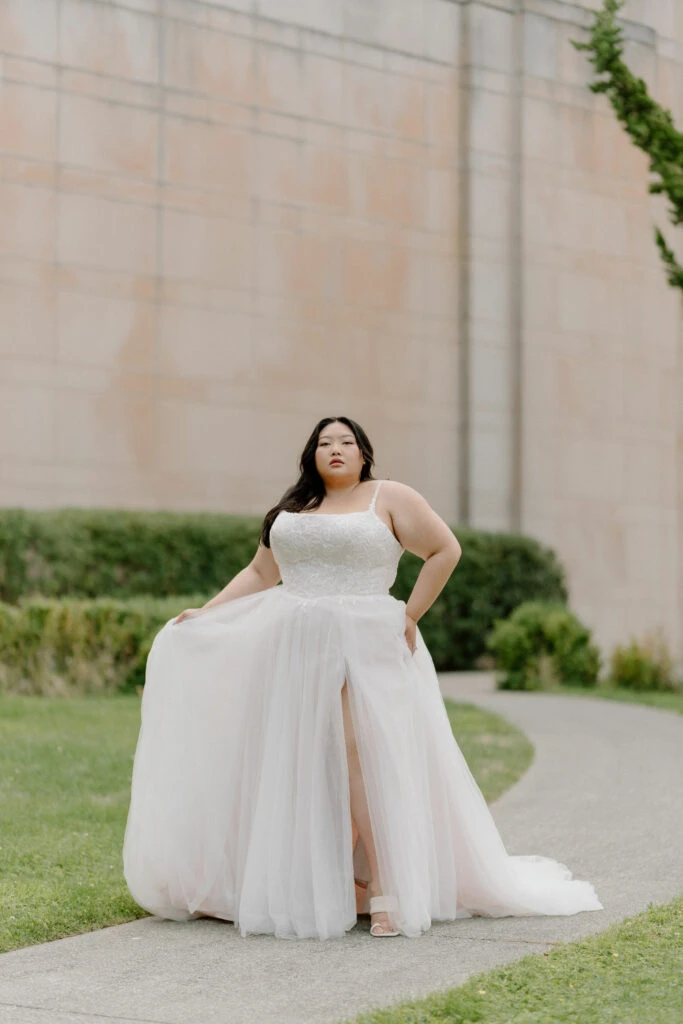 Bride wearing a lace tulle a-line wedding dress outside