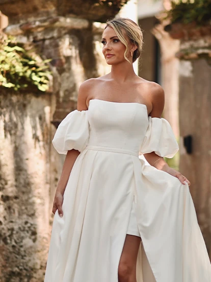 blonde model in white simple a-line wedding dress and puff sleeves