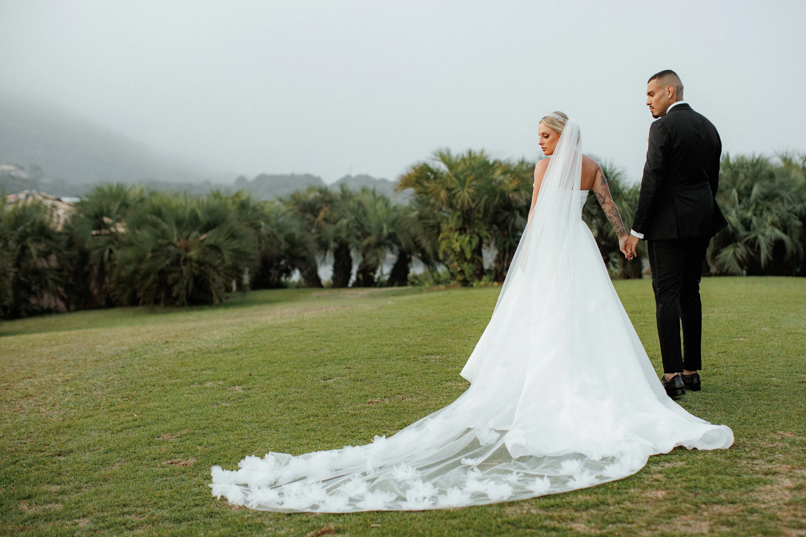 true bride mayke holding hands with husband wearing style D3941 by Essense of Australia