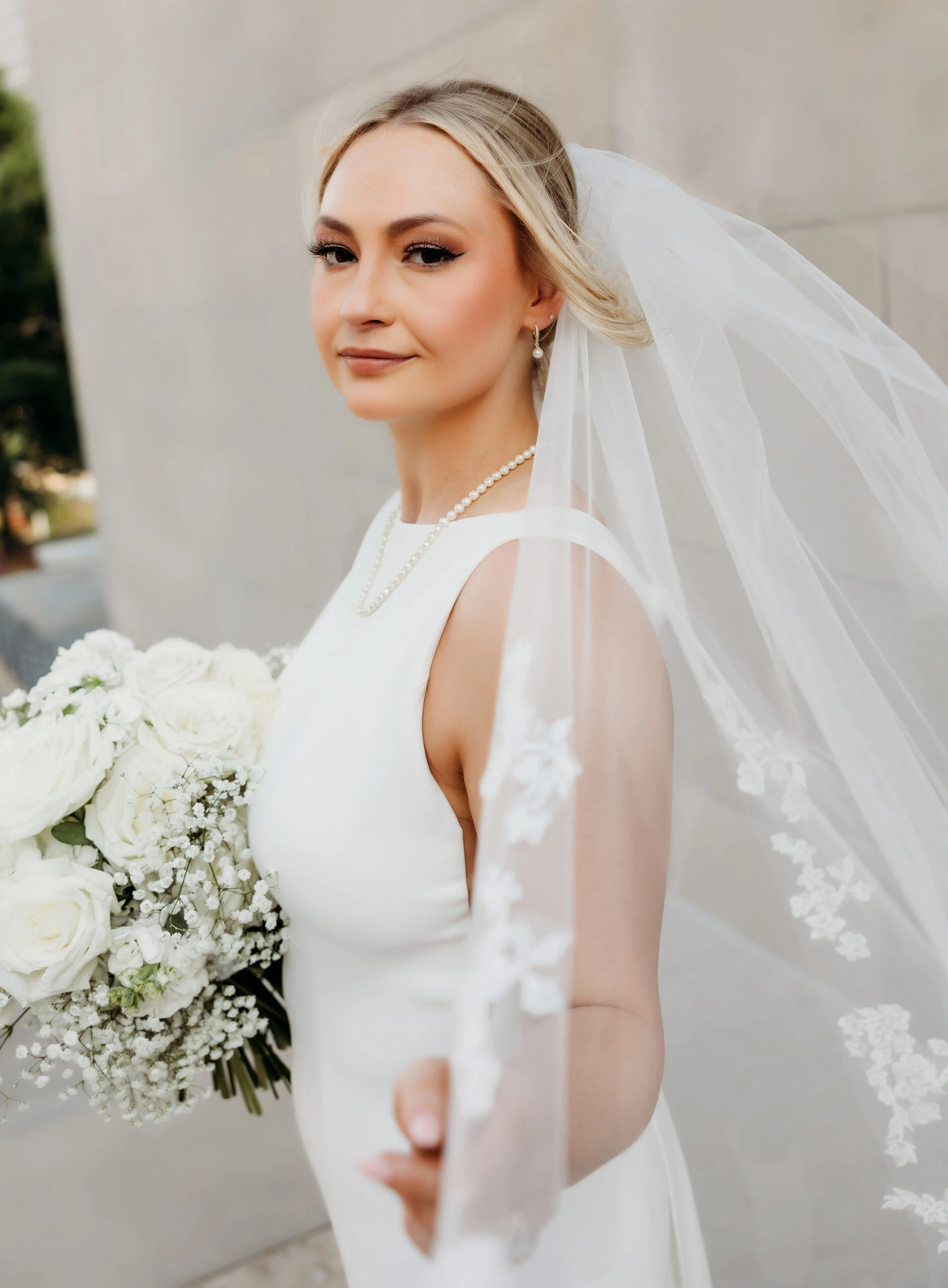 Bride Bailee smiling softly wearing D3901 by Essense of Australia