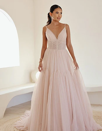 Bride wearing a v-neck tulle blush wedding dress