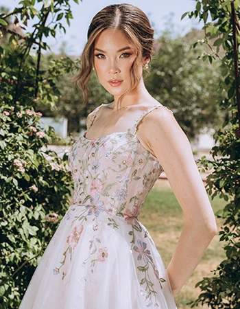 Bride wearing a colorful floral lace wedding dress 