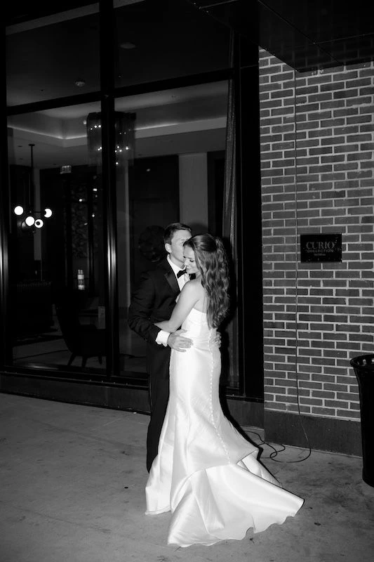 Bride and groom embracing