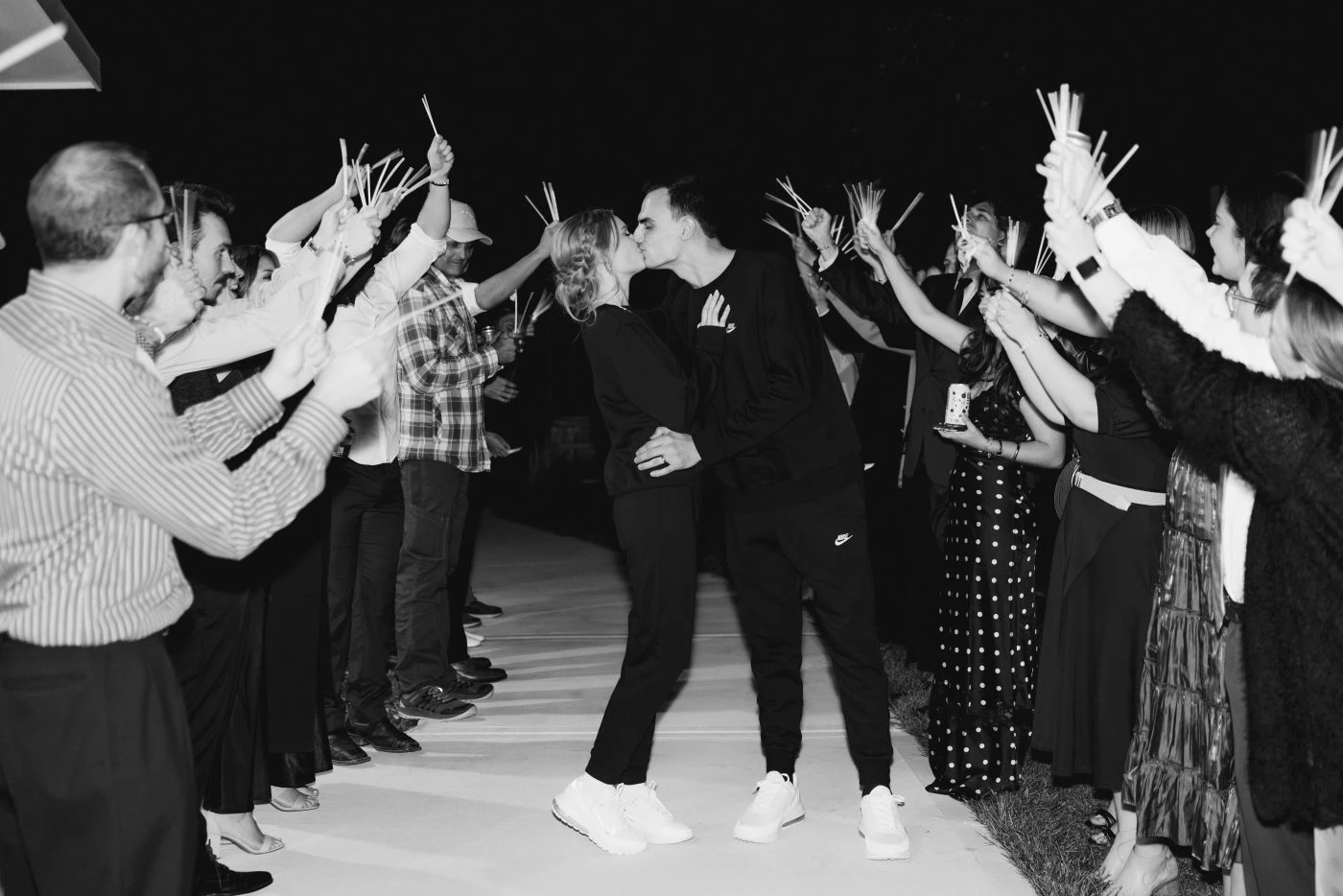 Couple surrounded by friends and family
