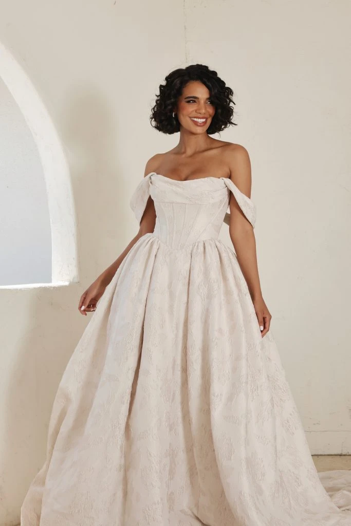 Bride wearing a off the shoulder ballgown wedding dress