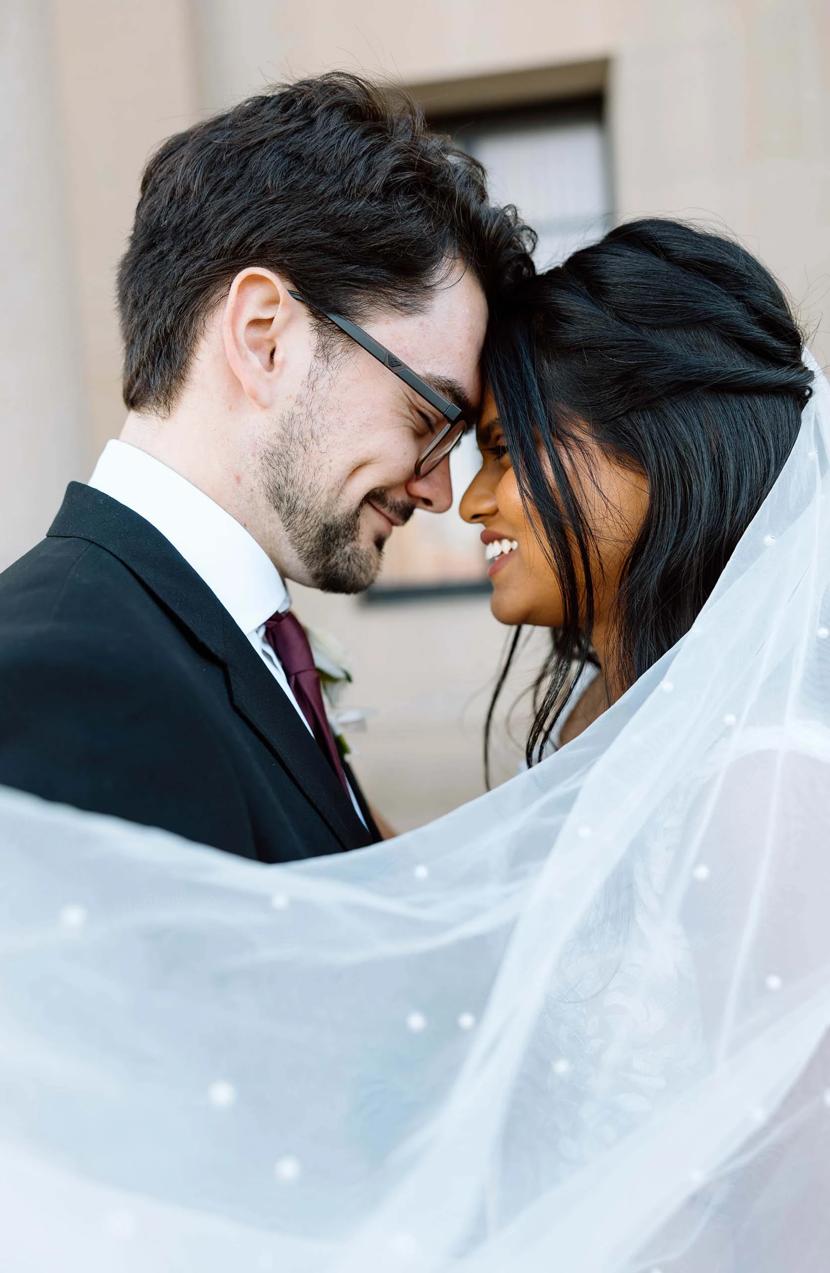 true bride serreena and william smiling face to face beneath a flowing wedding veil - 7715 by Stella York