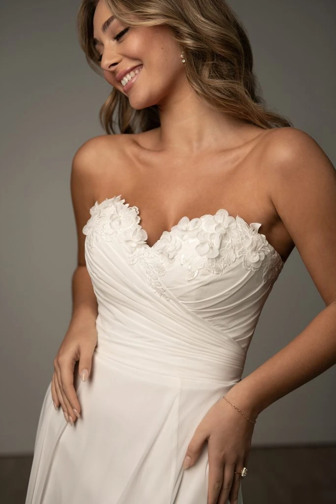 Bride wearing a floral sweatheart neckline a-line wedding dress.