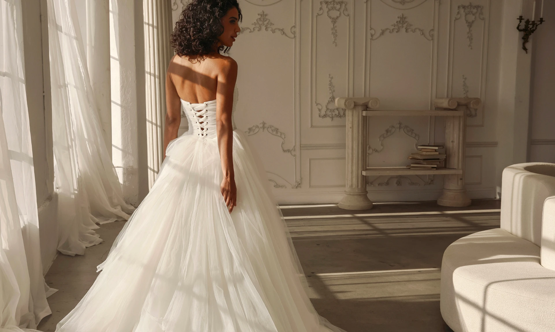 bride facing away from camera in a tulle ballgown wedding dress 