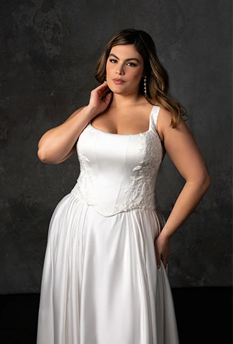 Bride wearing plus size sating wedding gown with square neckline and beaded lace