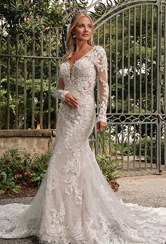 Bride wearing lace wedding dress with long sleeves