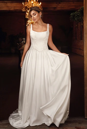 Bride wearing sating wedding dress with square neckline