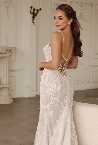 Bride wearing floral lace flit-and-flare wedding dress with sweetheart neckline