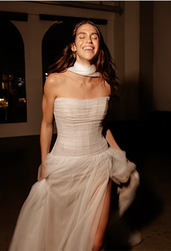 bride wearing boho tulle wedding dress with neck scarf - sabine by all who wander