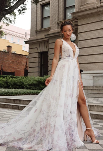 Bride wearing a-line wedding dress with plunging v-neckline and floral patterns