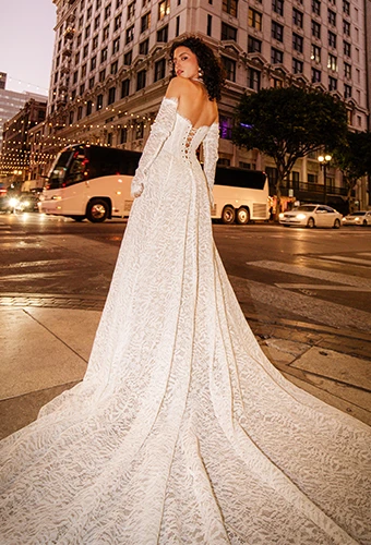 Bride wearing lace wedding dress with lace up back and optional sleeves