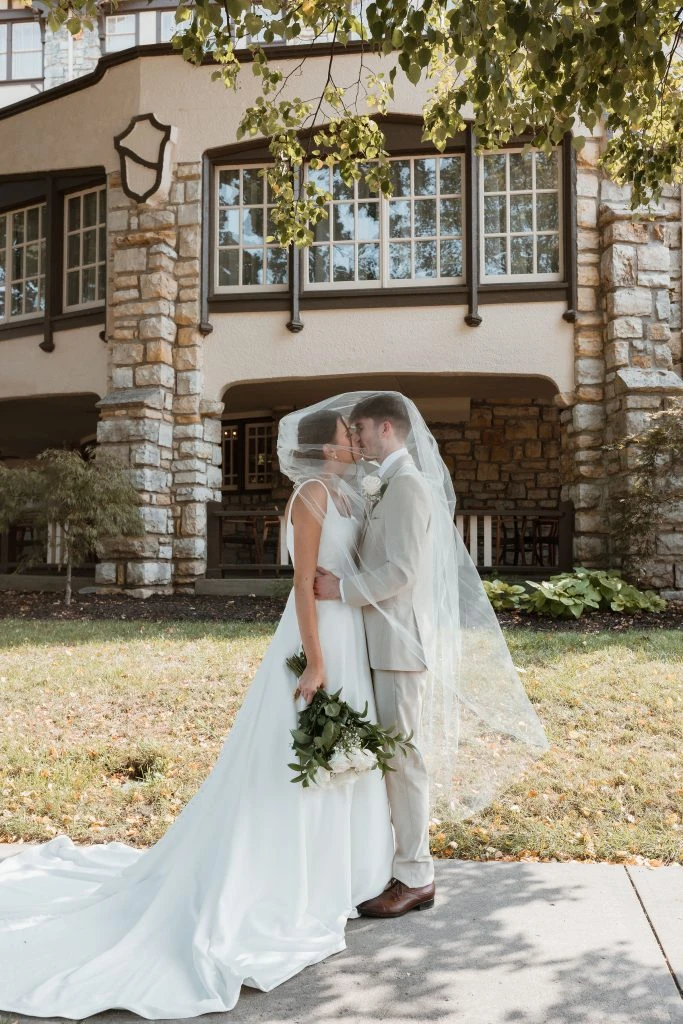 True Bride Genevieve posing in an embrace with her husband