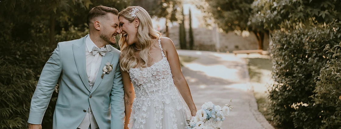 True bride Claudia posing with her husband