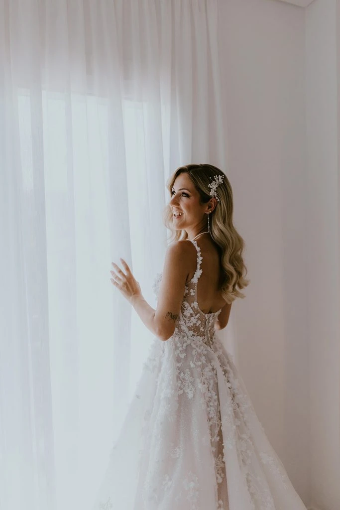 True bride Claudia showing off the back view of her wedding gown
