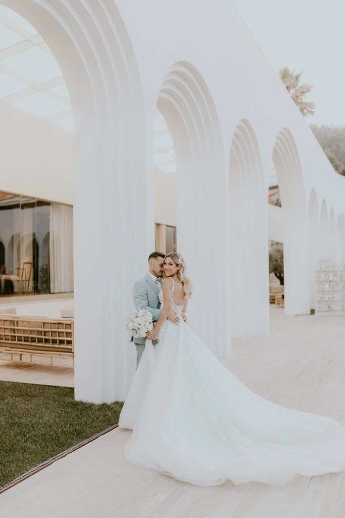 True bride Claudia posing with her husband