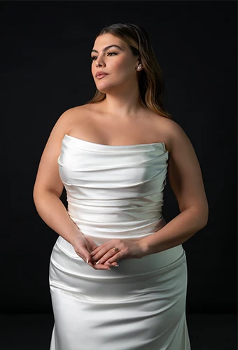 Bride wearing strapless satin fit-and-flare wedding dress
