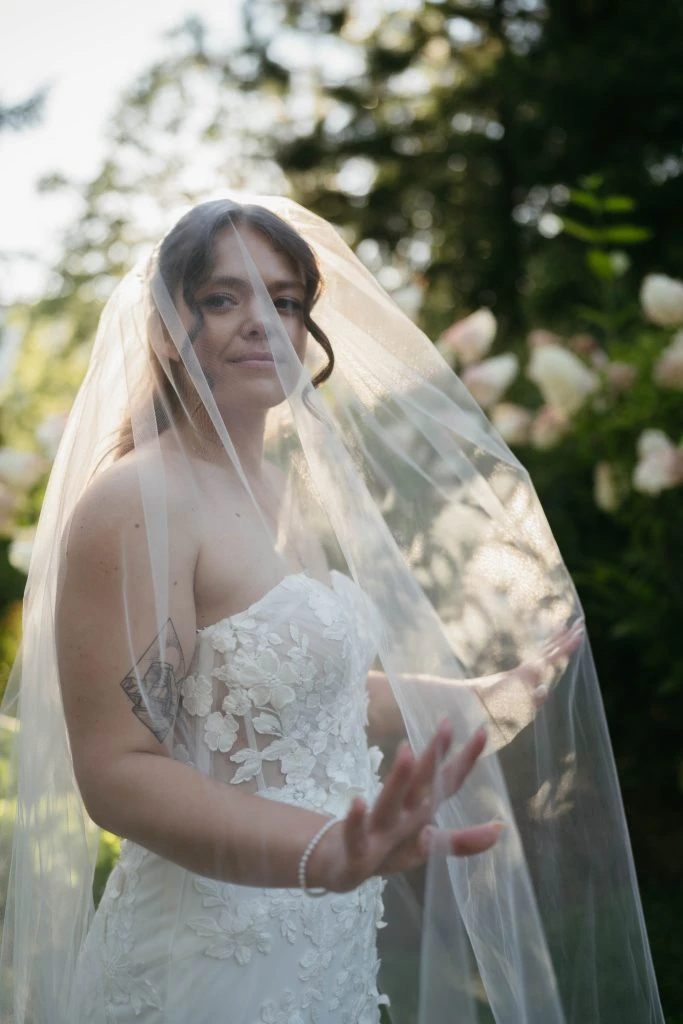 True bride Kate posing in her wedding gown with veil