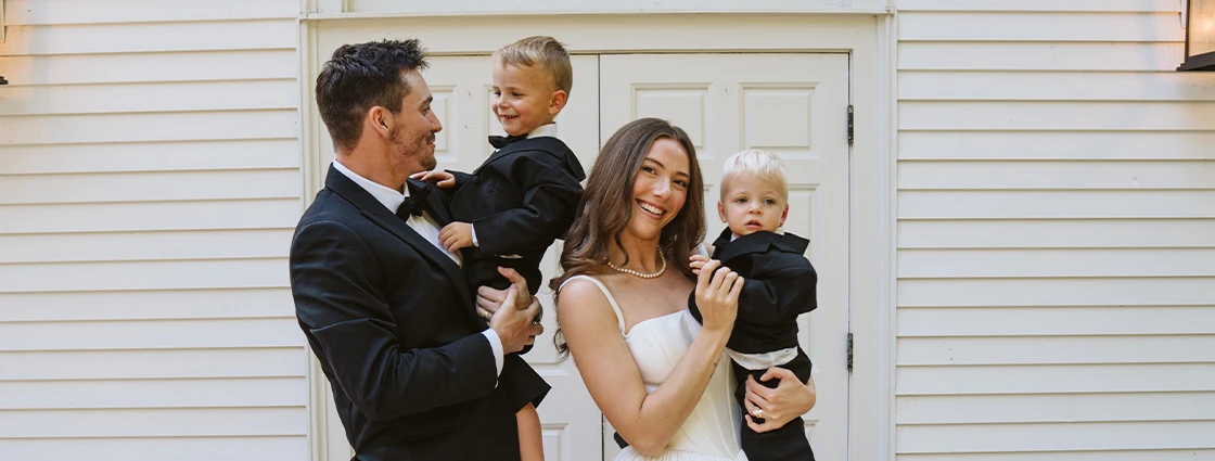 True bride Maya posing with her husband and family