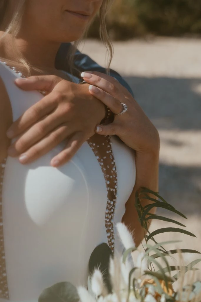 Close up of true bride Kelsey posing with her husband