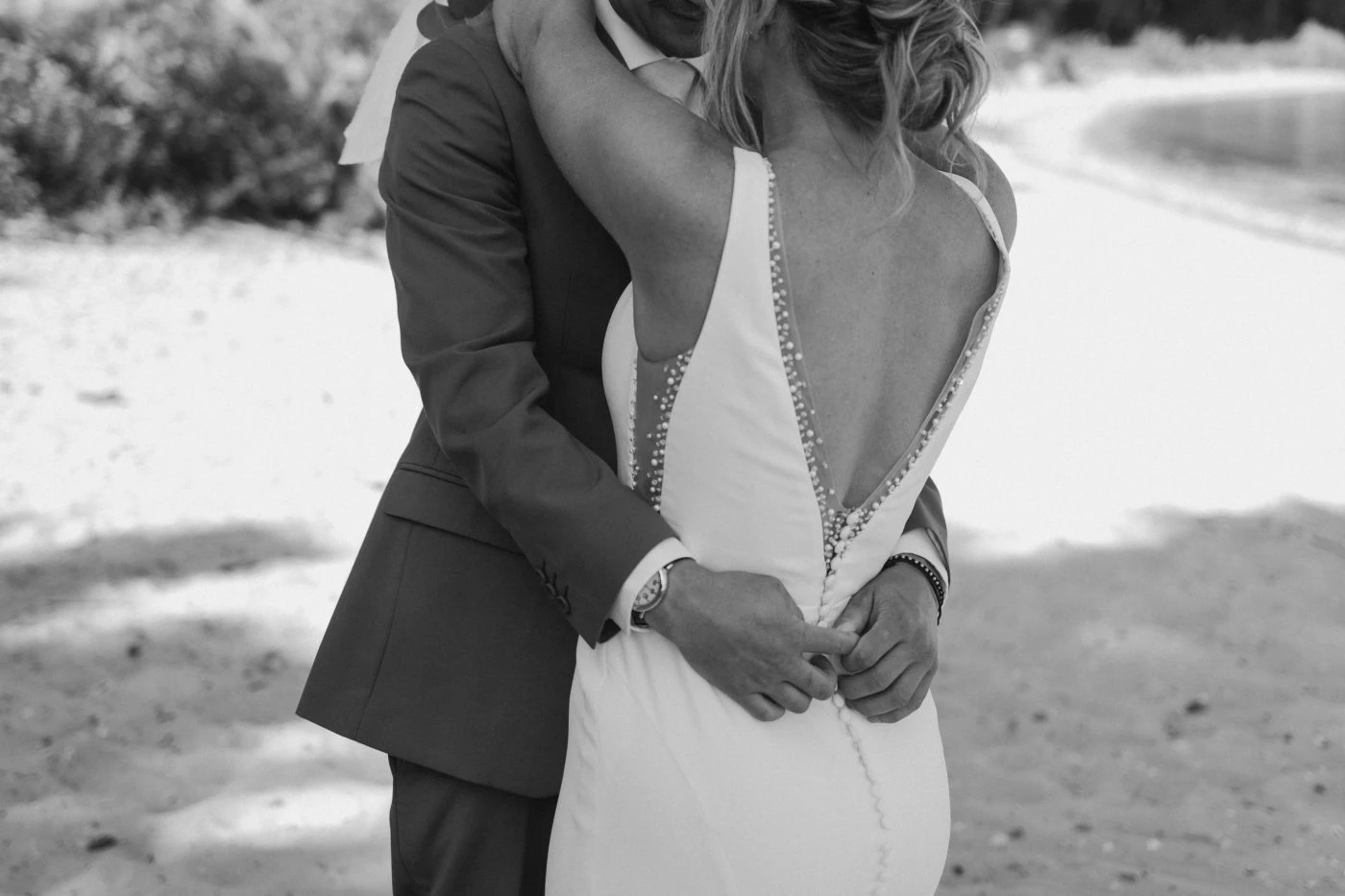 True bride Kelsey posing in an embrace with her husband