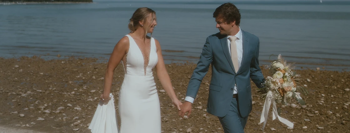 True bride Kelsey with her husband on the lakefront
