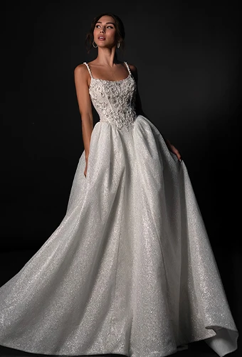 Bride wearing sparkling ballgown wedding dress with lace and beaded bodice