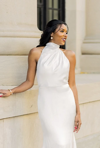 Bride wearing simple wedding dress with high halter neckline