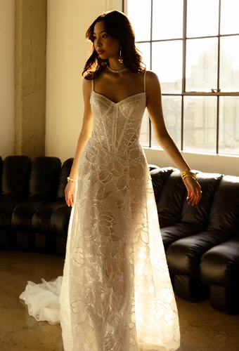 Bride wearing sparkling a-line wedding dress with all over lace