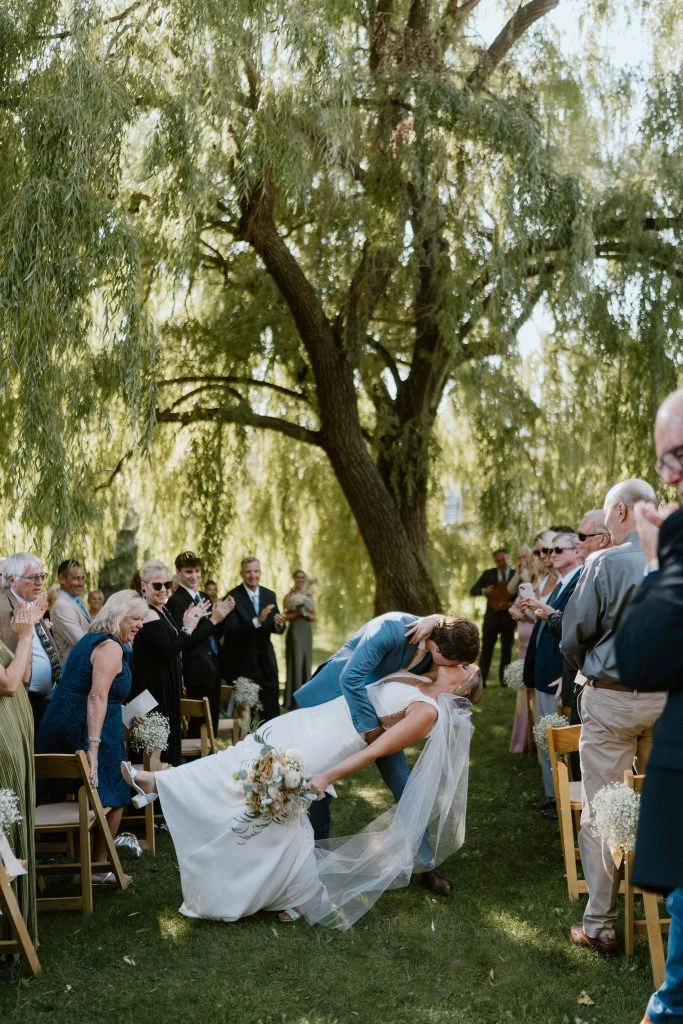 True bride Kelsey embracing her husband during their wedding ceremony