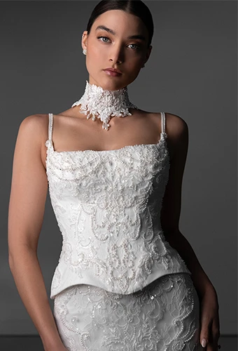 Bride wearing faux two piece wedding dress with all over lace and beading