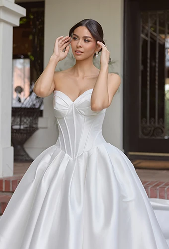Bride wearing ballgown wedding dress with deep sweetheart neckline