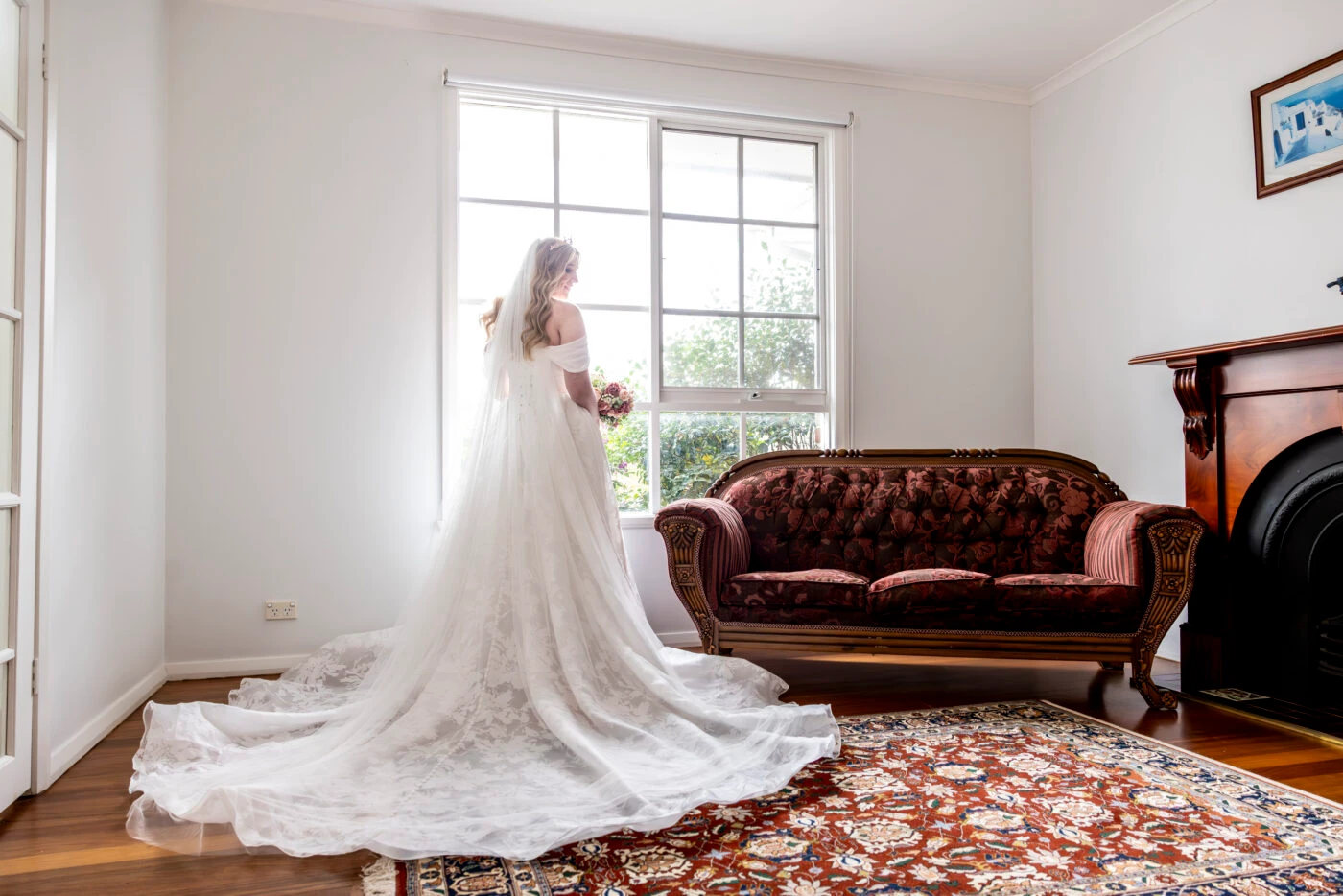 True bride Jaimee posing in her wedding gown