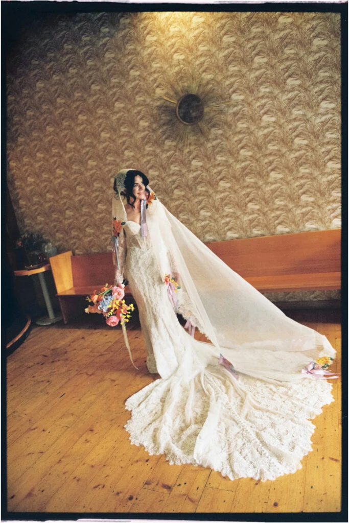 True bride Hannah posing in her wedding dress