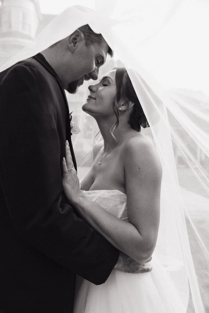 True bride Lauren posing with her husband in an embrace