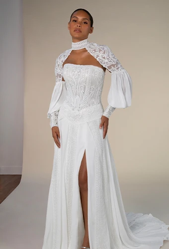 Bride wearing a-line wedding dress with lace bodice and statement sleeves