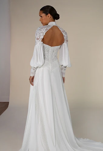 Bride wearing a-line wedding dress with lace bodice and statement sleeves