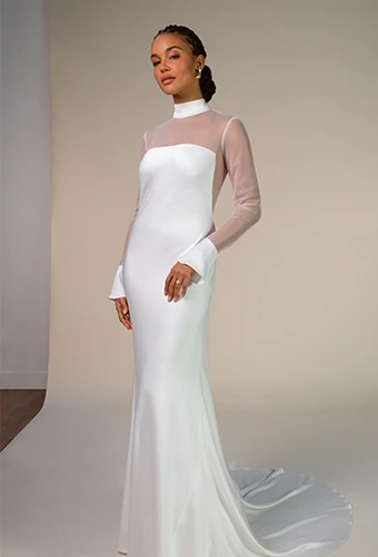 Bride wearing sating wedding dress with long sleeves and high neckline