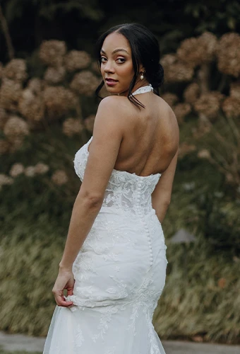 Bride wearing lace wedding dress with halter neckline