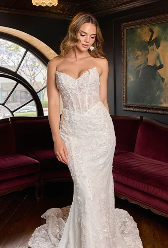 Bride wearing strapless fit-and-flare wedding gown with sparkling allover lace