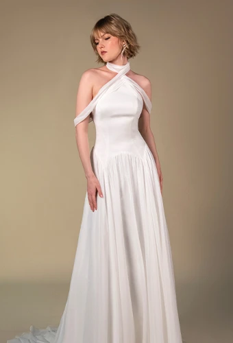 Plus size bride wearing printed a-line wedding dress with off-the-shoulder straps and high leg slit