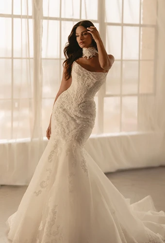 Bride wearing strapless mermaid wedding dress with lace and beaded details