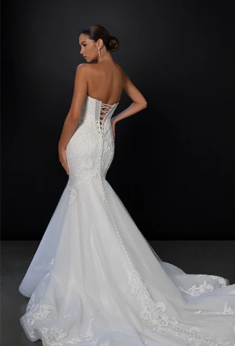 Bride wearing strapless mermaid wedding dress with lace and beaded details