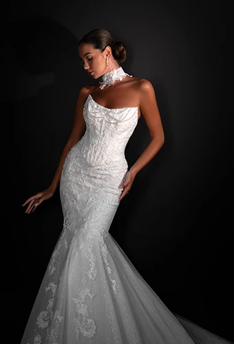 Bride wearing strapless mermaid wedding dress with lace and beaded details
