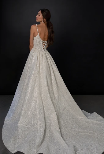 Bride wearing sparkling ballgown wedding dress with lace and beaded bodice